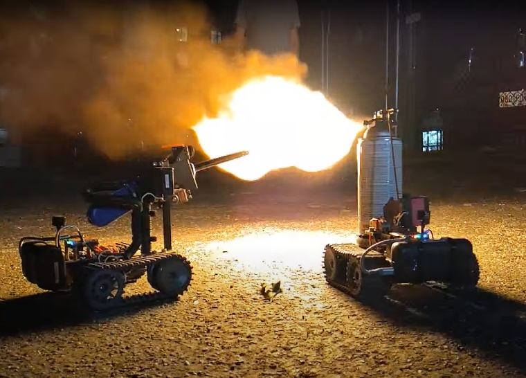 The aforementioned Torchy and Cindy collaborating by spraying and igniting a flaming ball of aerosol in a parking lot at night.